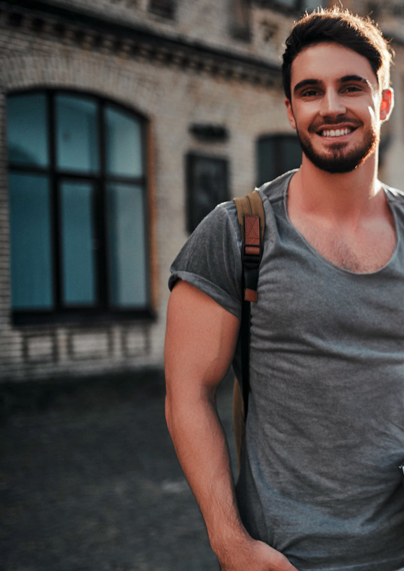 Students reviewing housing options on campus lawn